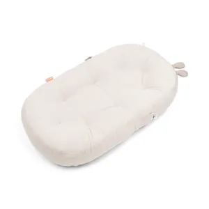 DONE BY DEER Cozy lounger With Activity Arch - Raffi Sand